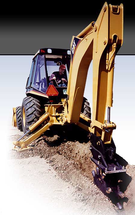Backhoe or loader using Barone Care-Free Compaction Wheel to compact soil and dirt in trench after excavation and installation of underground utilities.